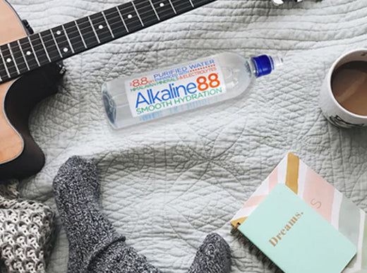 alkaline water bottle on bed
